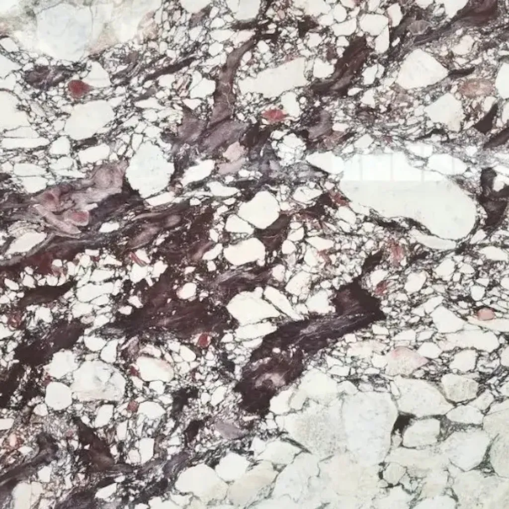 Calacatta Viola marble: white ground with dense violet-red breccia